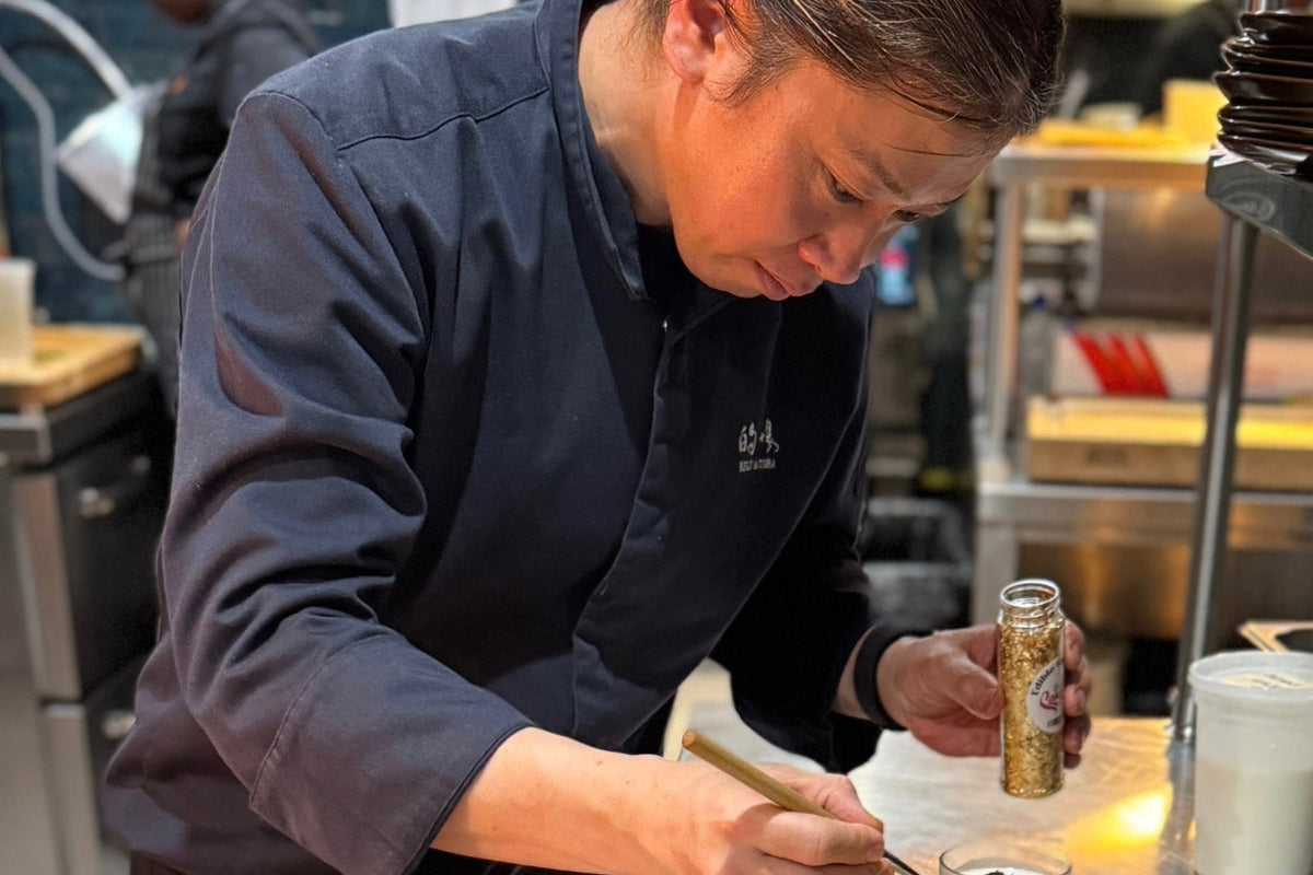 Chef Matoba finishing accompaniments in the kitchen
